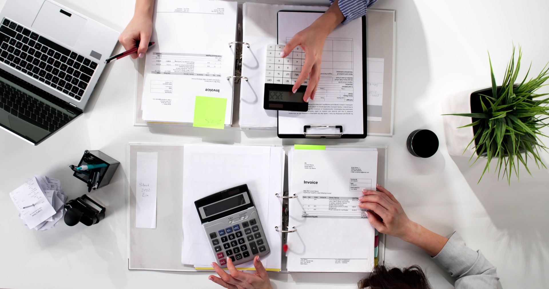 Top view of young woman accountant doing tax audit